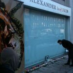Mourners pay tribute at Alexander McQueen's storefront in NYC.
