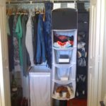 Organized closet with shoes, clothing, and storage solutions.