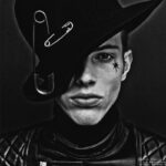 Model with unique hat and star tattoo in striking black and white