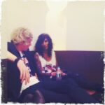 Arek and Gavin relaxing together in the USA, casual conversation, stylish outfits.