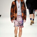 Model showcasing James Long's vibrant S/S '11 men's fashion collection.