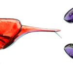 Colorful lollipops shaped like logos, featuring vibrant designs.