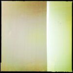 Soft morning light filtering through a pale wall