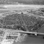 Aerial view of a camouflaged Boeing plant and surrounding neighborhood.