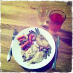 Plate of chicken, asparagus, rice, and mixed vegetables with drinks.