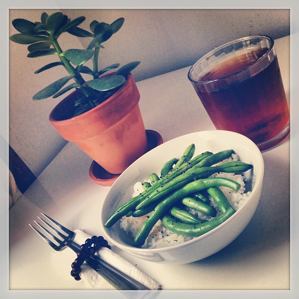 Home grown string beans with spicy teriyaki glaze over black poppy rice.