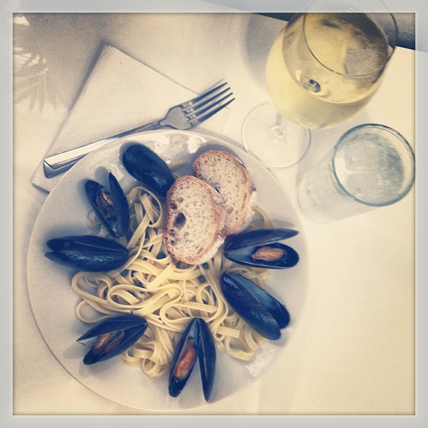 Mussels, fettuccine, capers in a white wine sauce