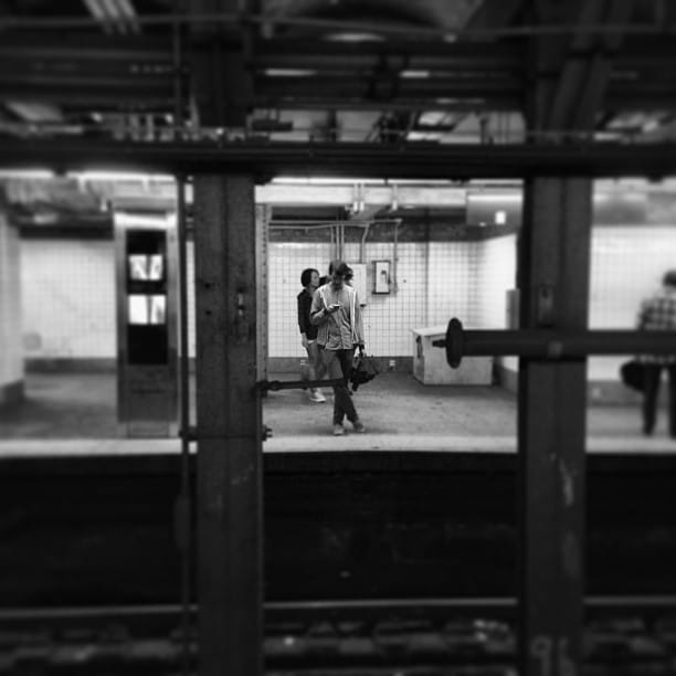 Andrew txting me across the platform