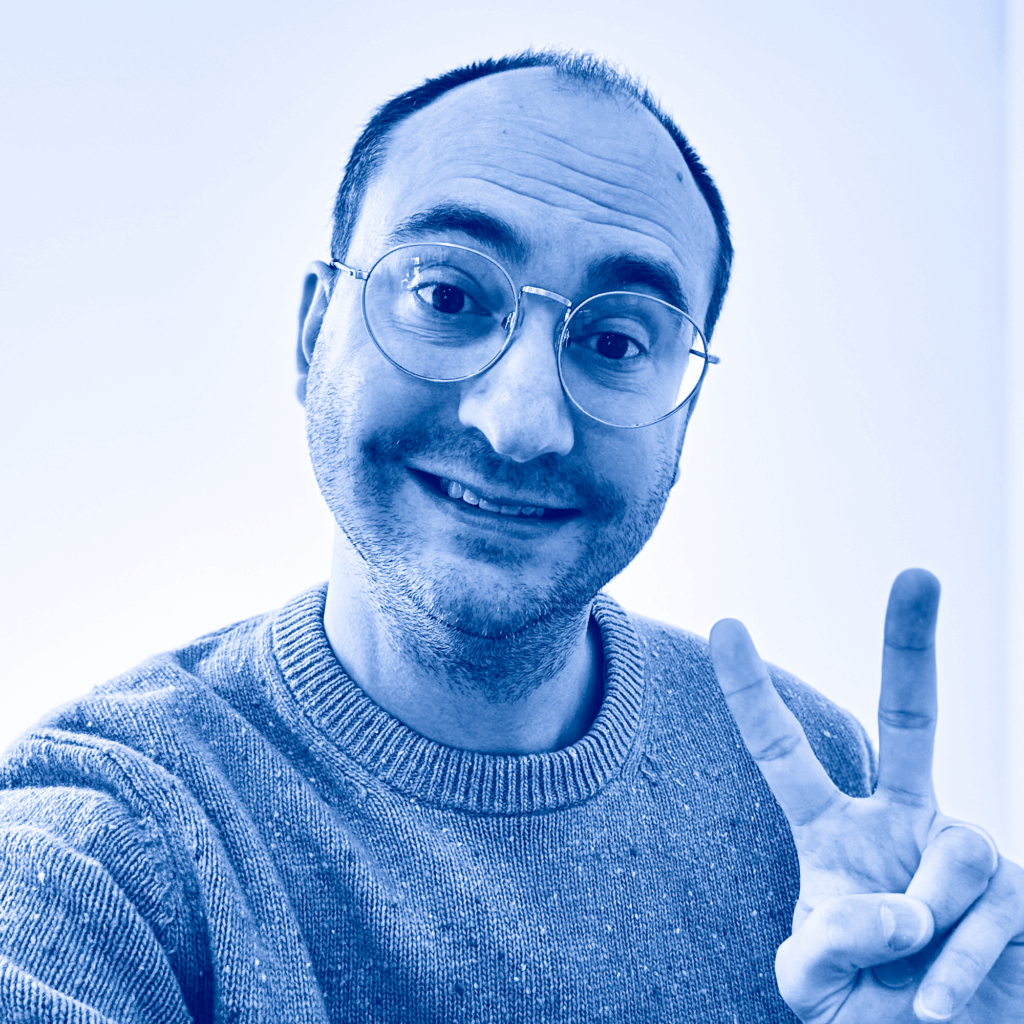 zachary martz smiling giving a peace sign