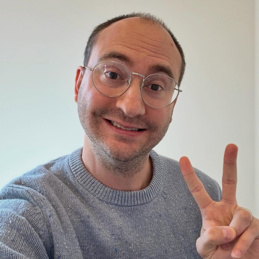 Zach smiling with Peace Sign